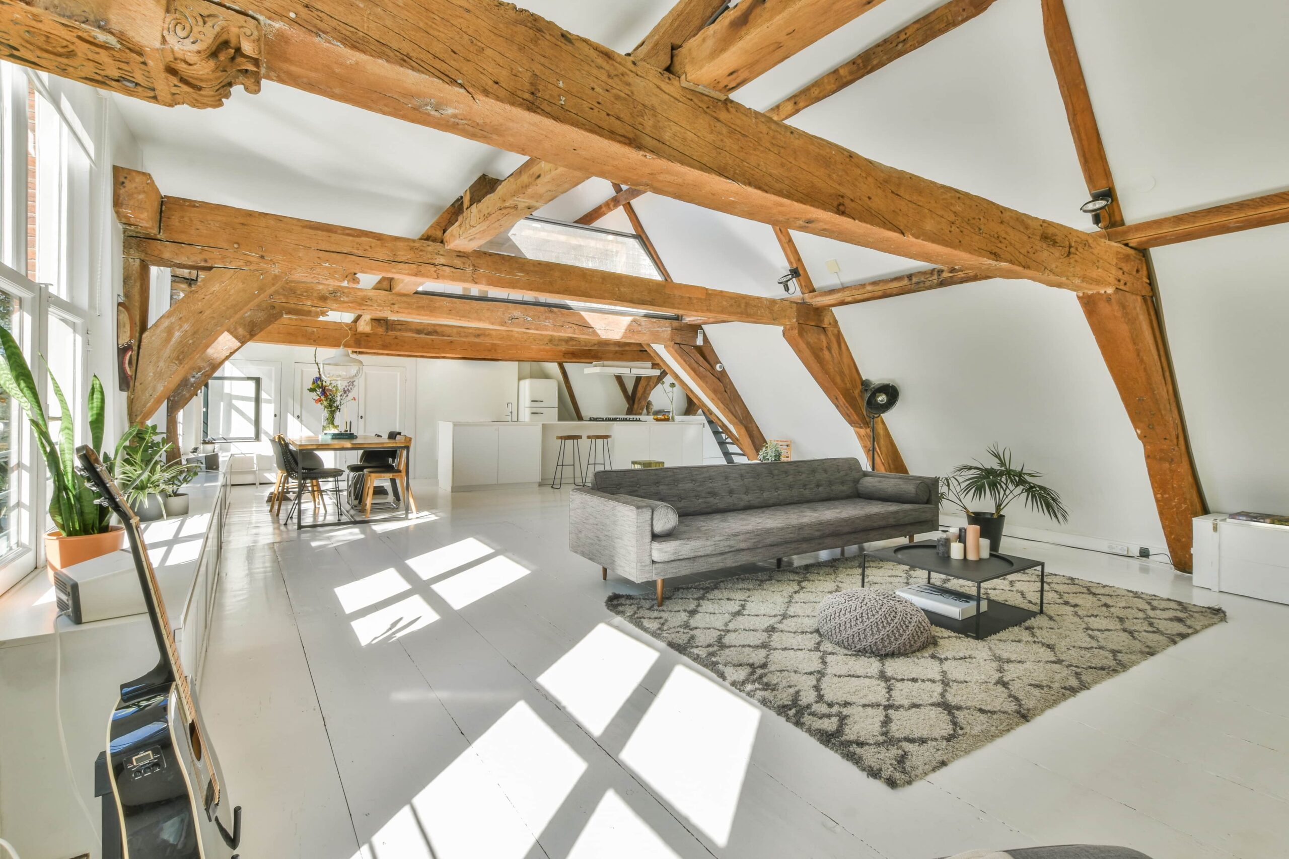 spacious-room-with-various-areas-under-white-ceiling-with-beams-3-scaled